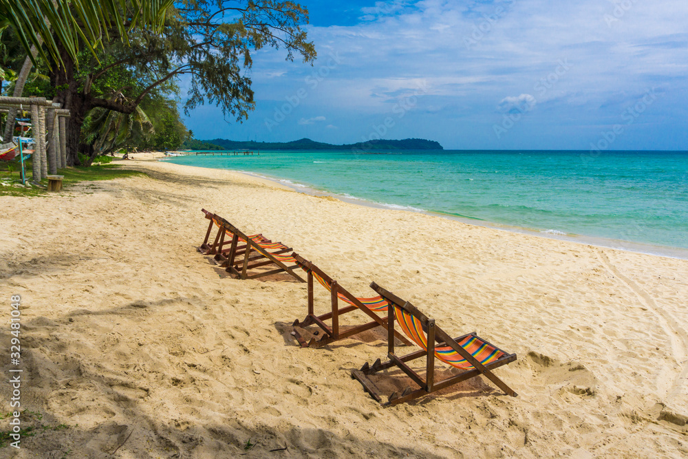 Colorful beach chair on white sand beach turquoise watere Colorful beach chair on white sand beach turquoise watere