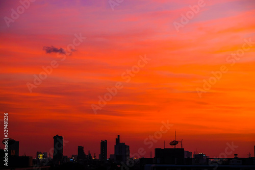 Silhouette city building sunset colorful sky with cloud