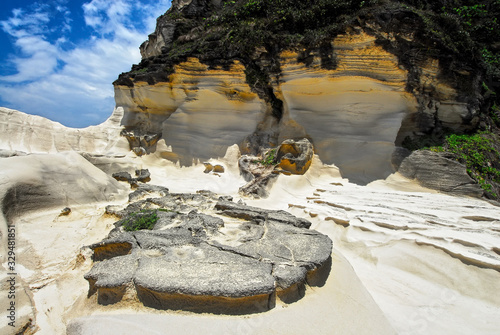 Scenic low-angle view of Capurpuraoan Rocks, also Kapurpurawan Rock Formation at the coast near Burgos, Ilocos Norte, North Luzon, Philippines, Asia photo