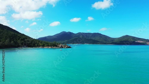 Wallpaper Mural Azure sea water reflecting bright blue sky with white clouds over tropical islands with green hills on Thailand Torontodigital.ca