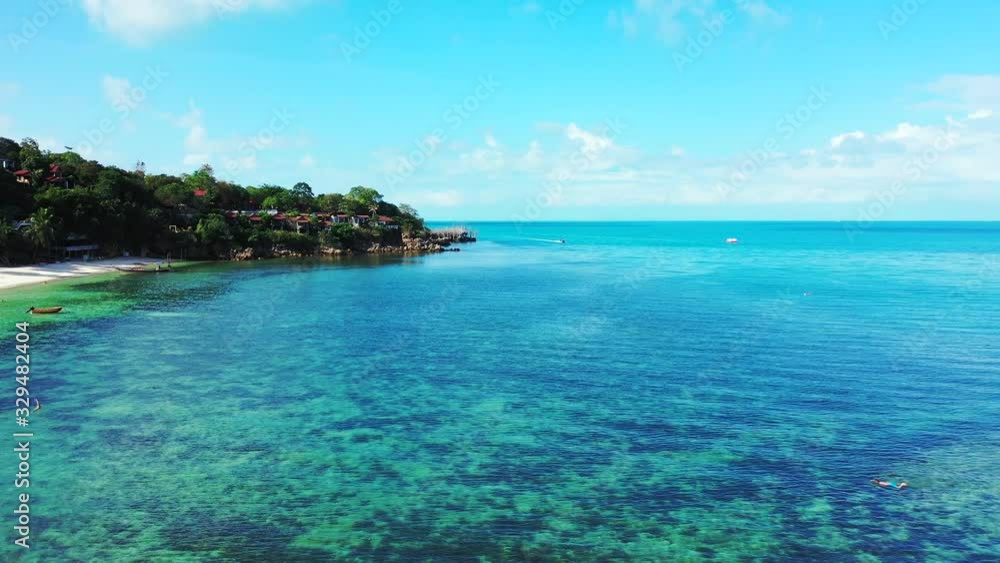 Beautiful lagoon with coral reefs growing on seabed under calm clear water near sandy exotic beach on tropical island Beautiful lagoon with coral reefs growing on seabed under calm clear water near sandy exotic beach on tropical island