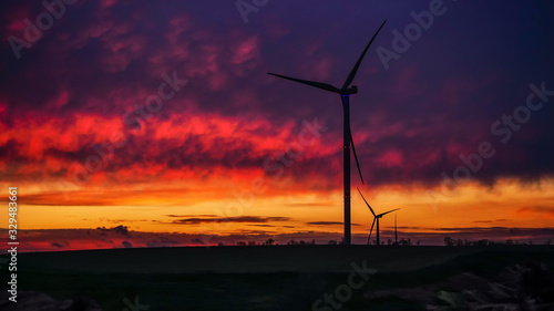 Wind generator triple set on scenic sundown