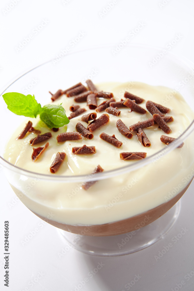 Vanilla and Chocolate Cream Mousse in Restaurant Glass Isolated