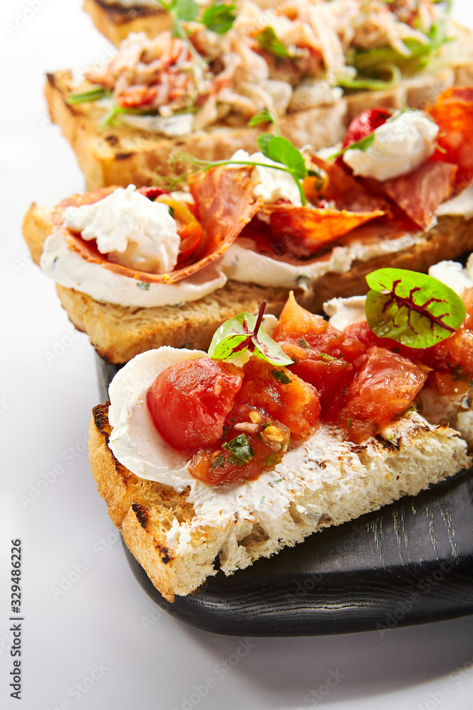 Bruschetta with baked tomatoes closeup view
