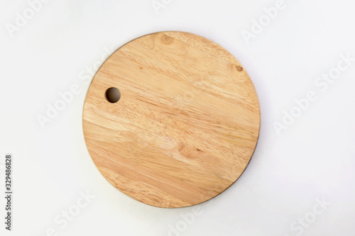 Top view of wooden cutting board isolated on a white background