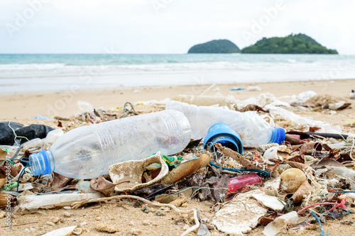 Plastic bottles and other trash on sea beach