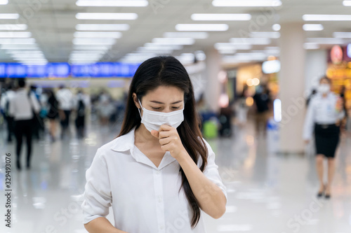 Woman wearing medical mask to protect against coronavirus.
