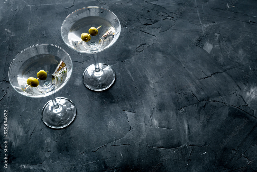 Fototapeta premium Martini with olives on grey background copy space