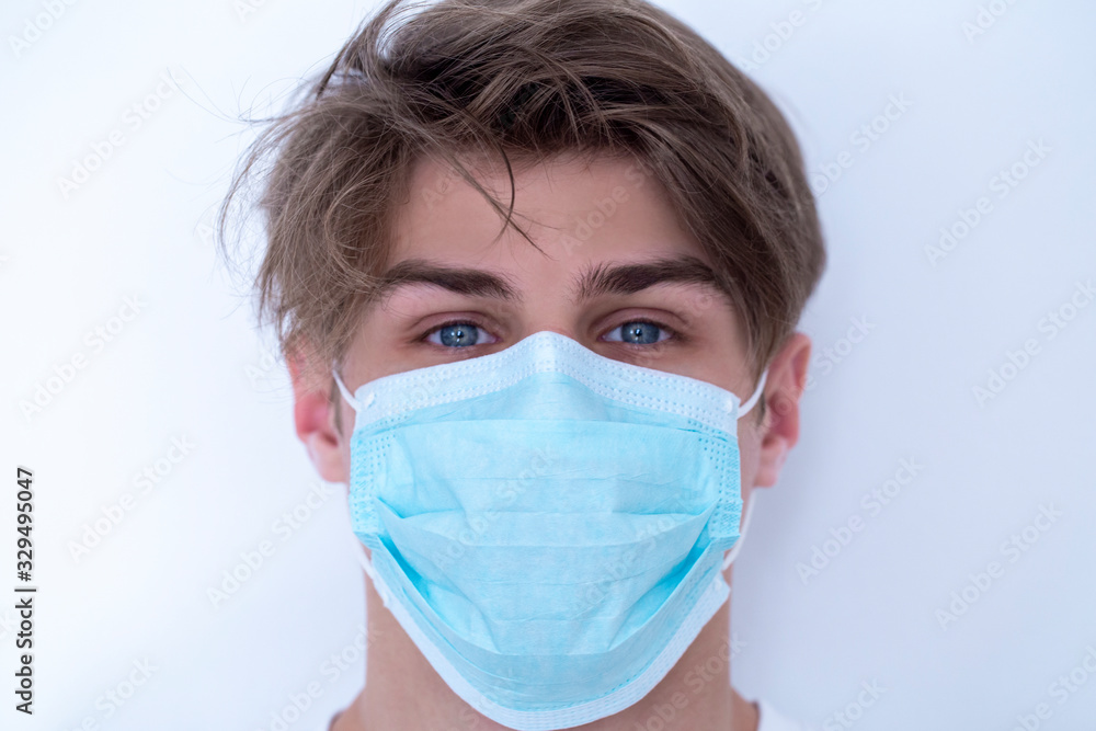 a man in a protective medical mask. prevention of viruses a man in a protective medical mask. prevention of viruses