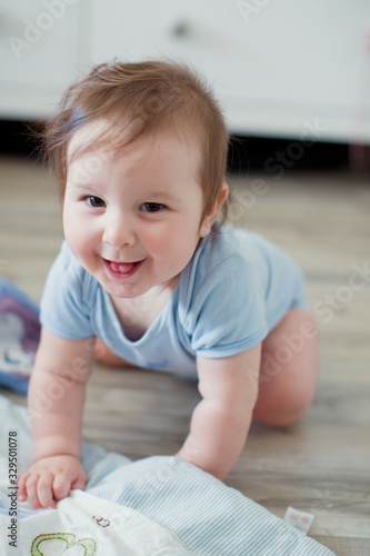 Cute caucasian baby in a blue cloth
