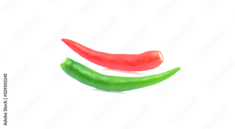 Fresh red and green hot chili peppers on white background Fresh red and green hot chili peppers on white background