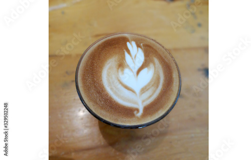Coffee latte art on wood table