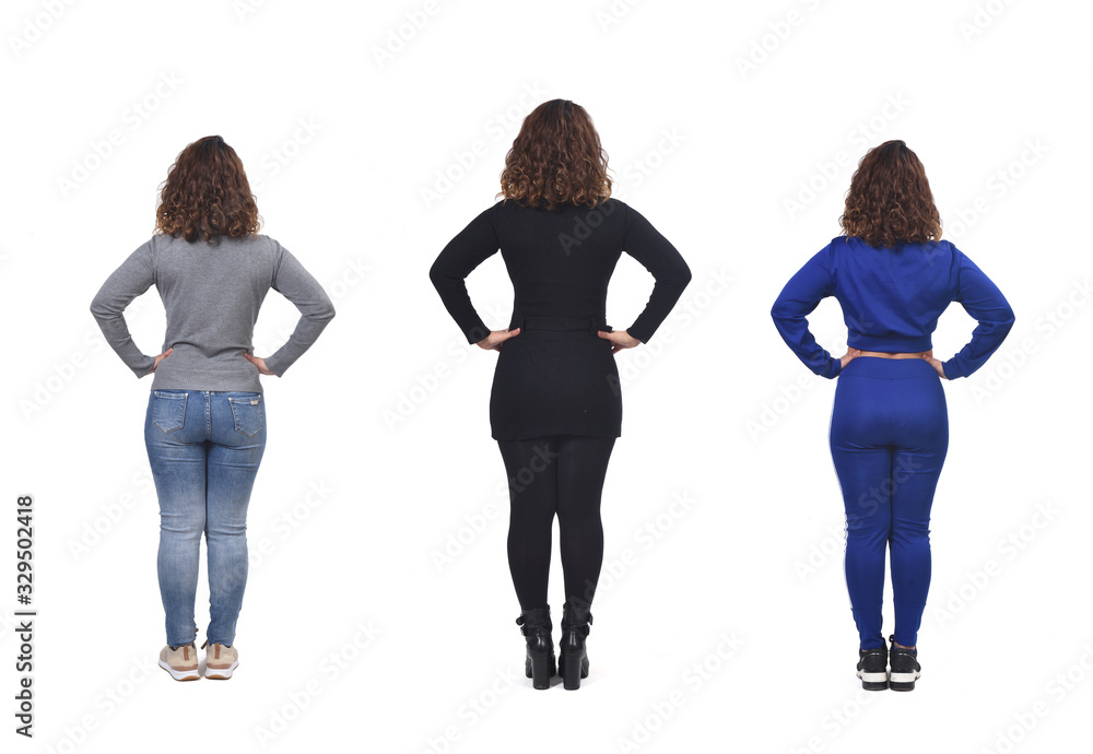 Fototapeta premium the same woman with casual elegant clothes and sportswear, hands on hip rear view