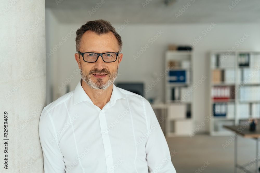 Fototapeta premium Thoughtful calm businessman staring at the camera