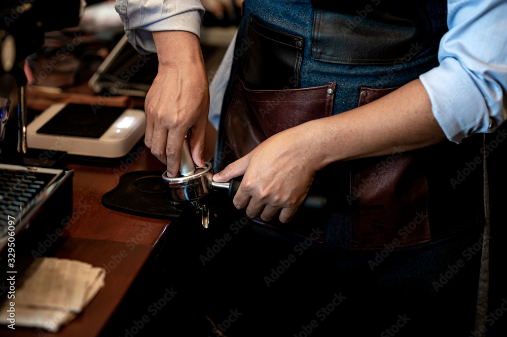 Barista make coffee with espresso machine in cafe. Barista male hands make fresh coffee close-up. Coffee machine and hands professional barista. Barista make coffee with espresso machine in cafe. Barista male hands make fresh coffee close-up. Coffee machine and hands professional barista.