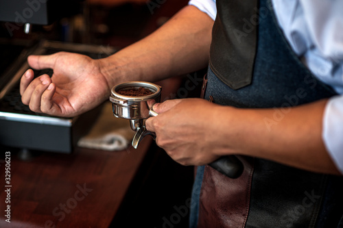 Barista prepare to make coffee with the espresso machine