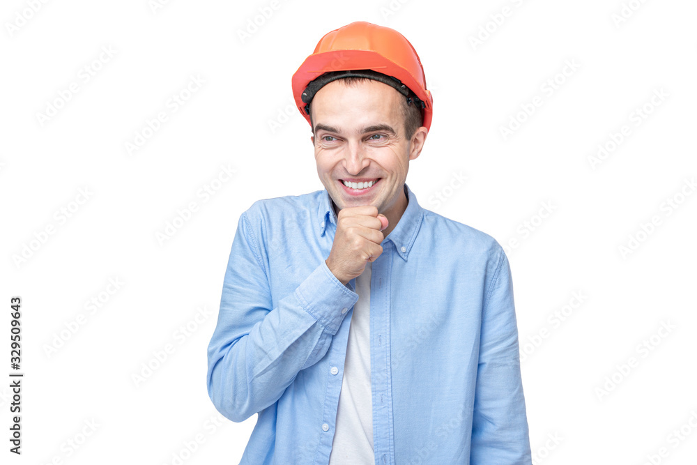 Joyful builder in helmet giggles, isolated background, copy space Joyful builder in helmet giggles, isolated background, copy space