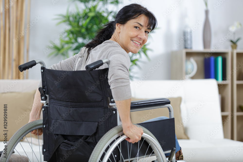 happy disabled senior woman in wheelchair at home happy disabled senior woman in wheelchair at home