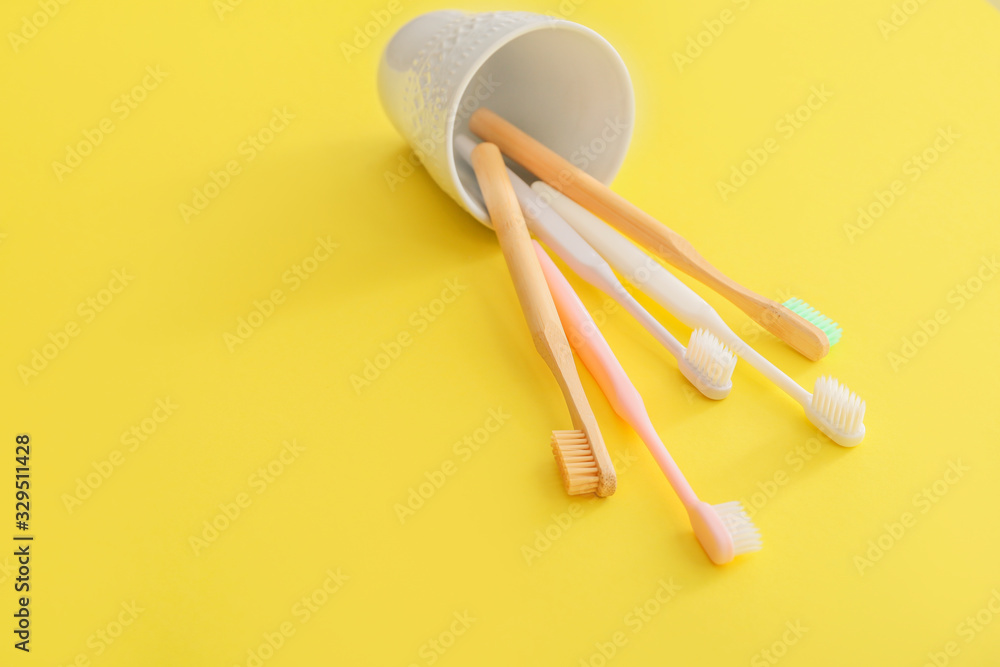 Holder with tooth brushes on color background Holder with tooth brushes on color background