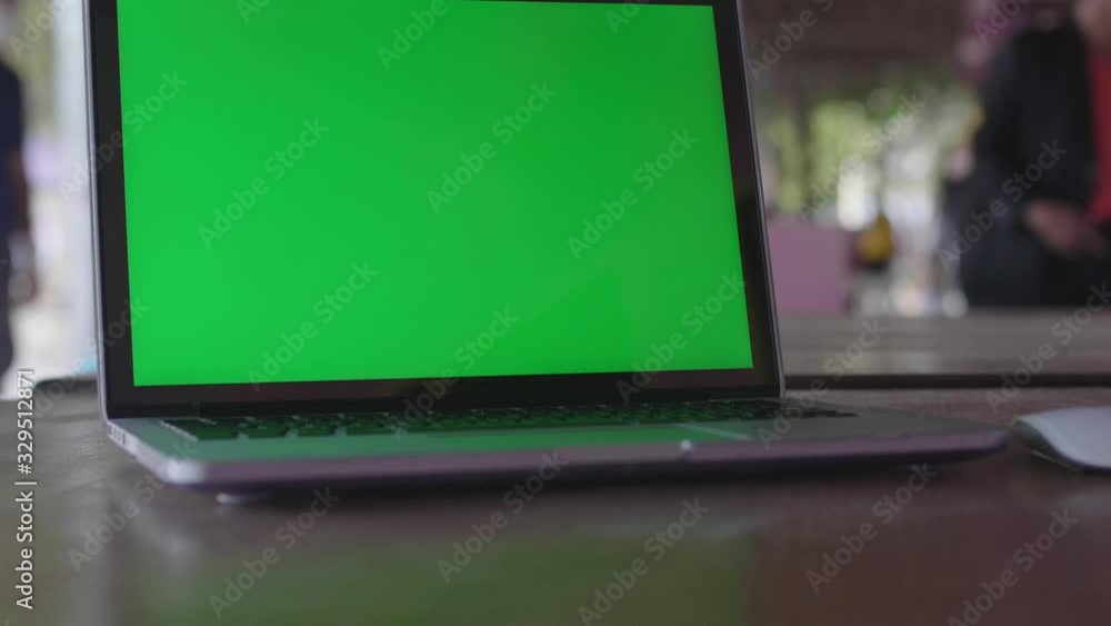 4K Green screen of laptop computer set on working space . 4K Green screen of laptop computer set on working space .