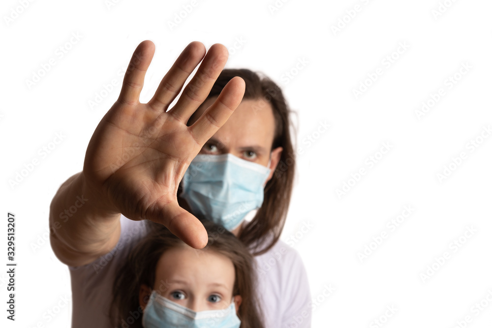 Stop coronavirus. The masked man shows a hand gesture. Stop. Protecting your family