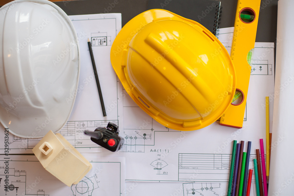 Concept Architect and desk of Architectural project in construction site or office building with mining light Concept Architect and desk of Architectural project in construction site or office building with mining light