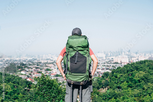 Adventurous man with backpack outdoors