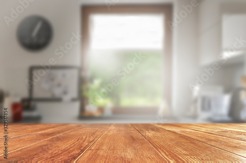 Desk of free space and blurred window background 