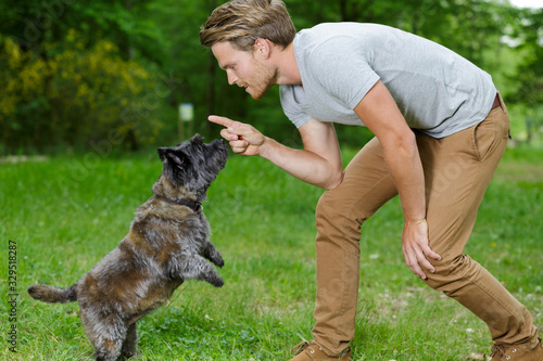 a young man training a dog