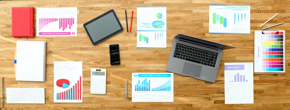 Paper with business chart on wooden office table closeup background. Finansial webinar concept. Site header mockup