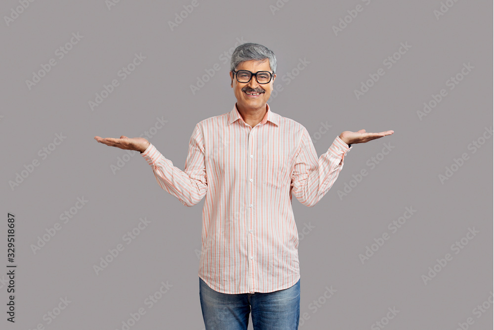 Senior man standing and showing his empty palms. Senior man standing and showing his empty palms.