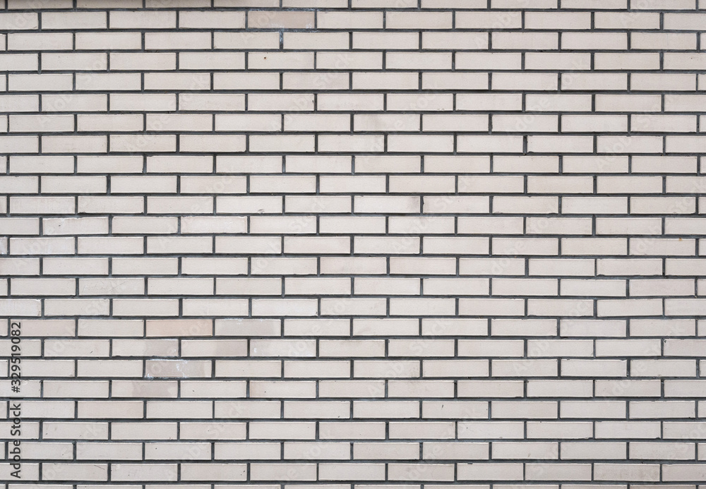 Texture light gray brick wall. Fragment of a house wall Texture light gray brick wall. Fragment of a house wall