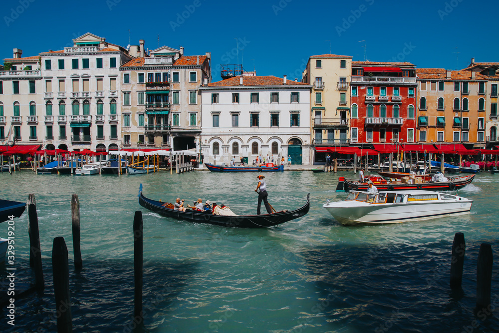 VENICE, ITALY -APRIL 8: Gondolas and tourists on April 8, 2011 in Venice, Italy. Venice has an average of 50,000 tourists a day and was the 26th most visited city in the world.