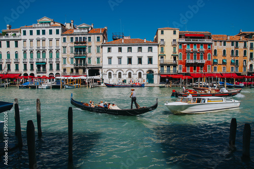 VENICE, ITALY -APRIL 8: Gondolas and tourists on April 8, 2011 in Venice, Italy. Venice has an average of 50,000 tourists a day and was the 26th most visited city in the world. © belyaaa