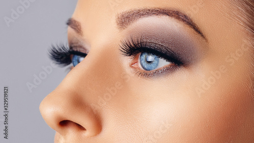 Woman eyes with long eyelashes and smokey eyes make-up. Eyelash extensions, makeup, cosmetics, beauty