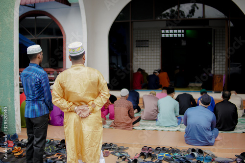 Muar, Johor, Malaysia - AUGUST 11, 2019: Muslims perform Eid al-Adha prayers or Hari Raya Aidiladha at Jamek Muar Mosque, Johor. photo