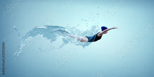 Professional man swimmer on a wave photo