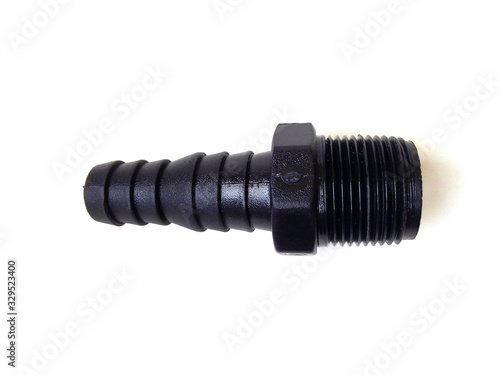 Close up of black plastic pipe fitting isolated on white background. Water pipe.
