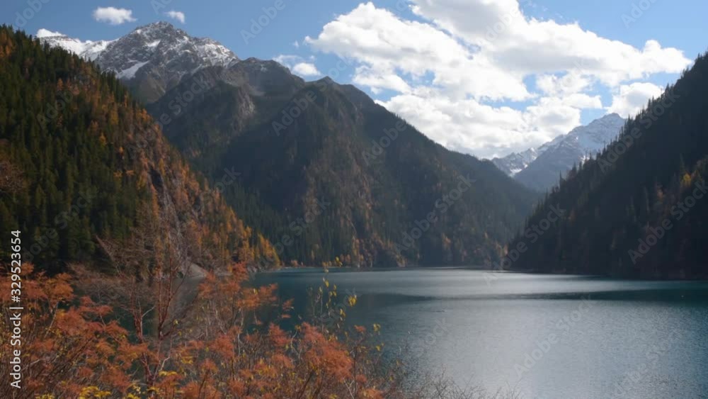 View of the Long Lake among snow-capped mountains View of the Long Lake among snow-capped mountains