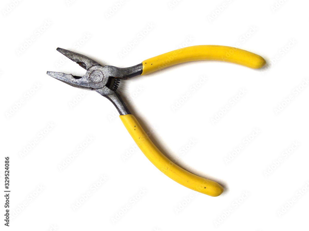 Close up of electrical pliers isolated on white background. Yellow handle pliers. Hand tool. Close up of electrical pliers isolated on white background. Yellow handle pliers. Hand tool.