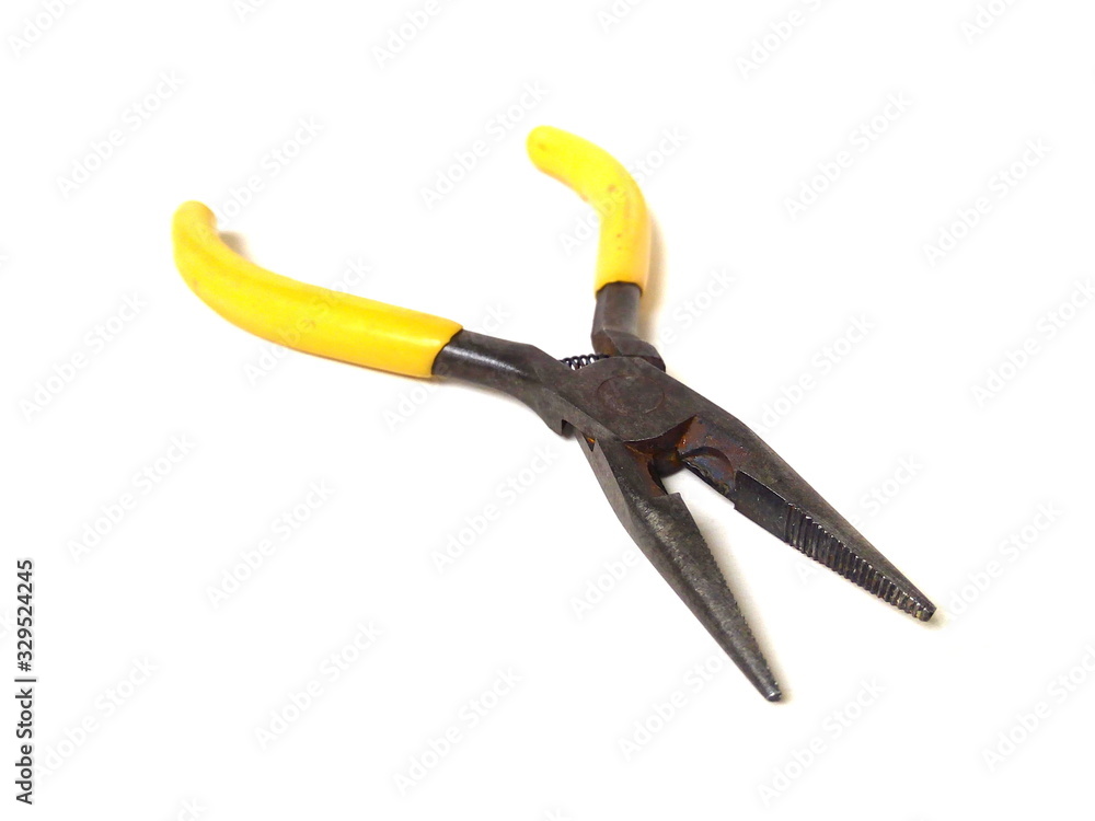 Close up of electrical pliers isolated on white background. Yellow handle pliers. Hand tool. Close up of electrical pliers isolated on white background. Yellow handle pliers. Hand tool.