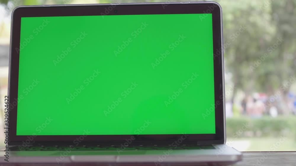 4K Green screen of laptop computer set on working space . 4K Green screen of laptop computer set on working space .