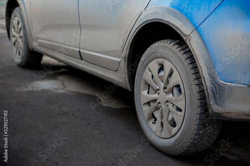 dirt and dust on the body and wheels of a car, chemistry and salt
