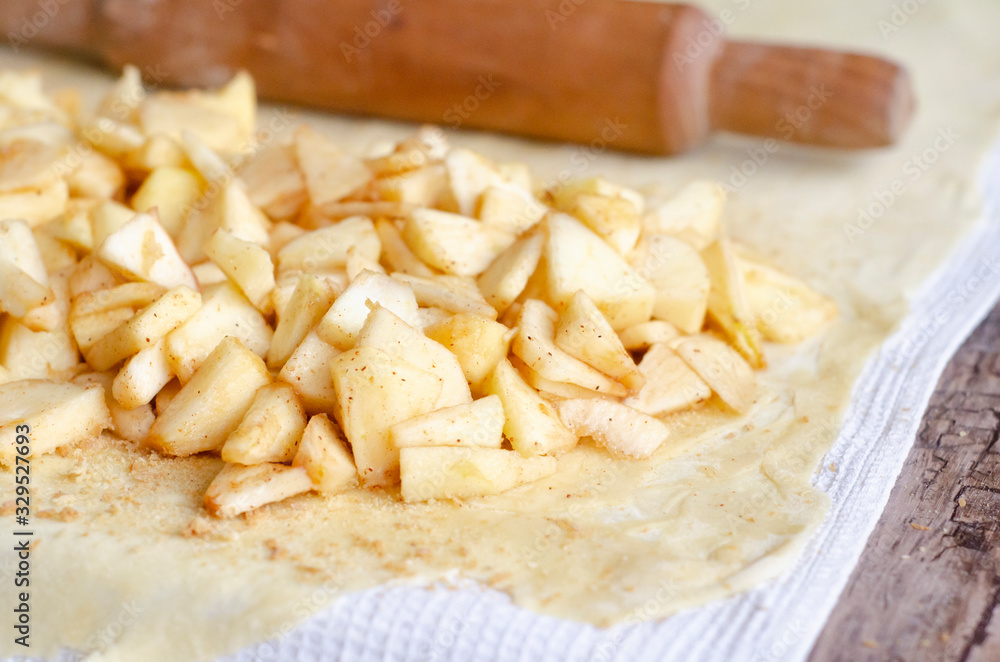 Homemade apple strudel with fresh apples. Cooking apple strudel Homemade apple strudel with fresh apples. Cooking apple strudel