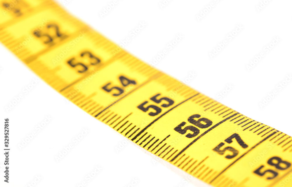 Close-up of a yellow measuring tape isolated on white - 56 Close-up of a yellow measuring tape isolated on white - 56