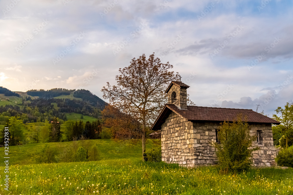 Obraz premium small old chapel in the swiss alps