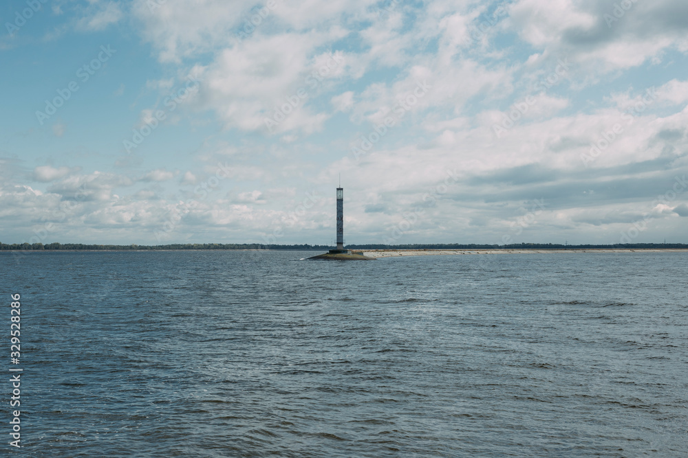 sea lighthouse. blue sea. good weather. 