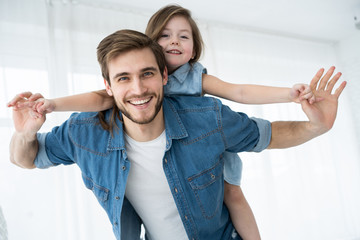 Happy loving family. Father and his daughter child girl playing together. Father's day concept