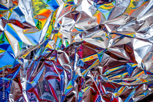 rainbow aluminium foil crumpled Silver texture abstract background