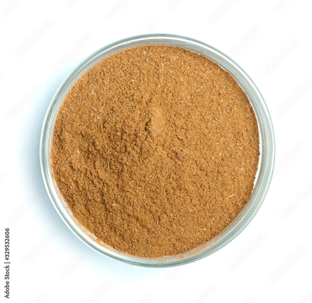 Powdered cinnamon in bowl Powdered cinnamon in bowl